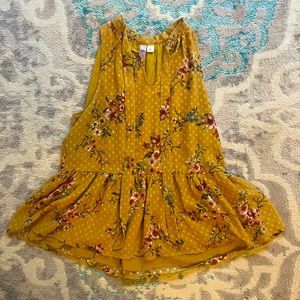 Francesca’s peplum gold floral top.